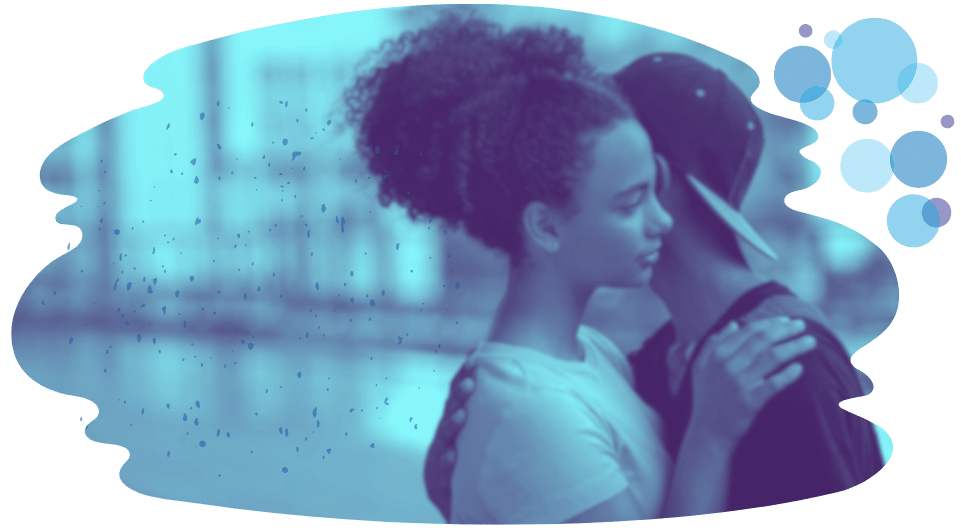 Teen girl and boy hugging