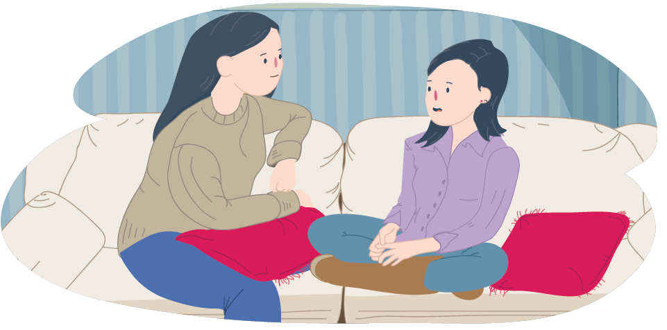 Mother and daughter sitting on couch talking